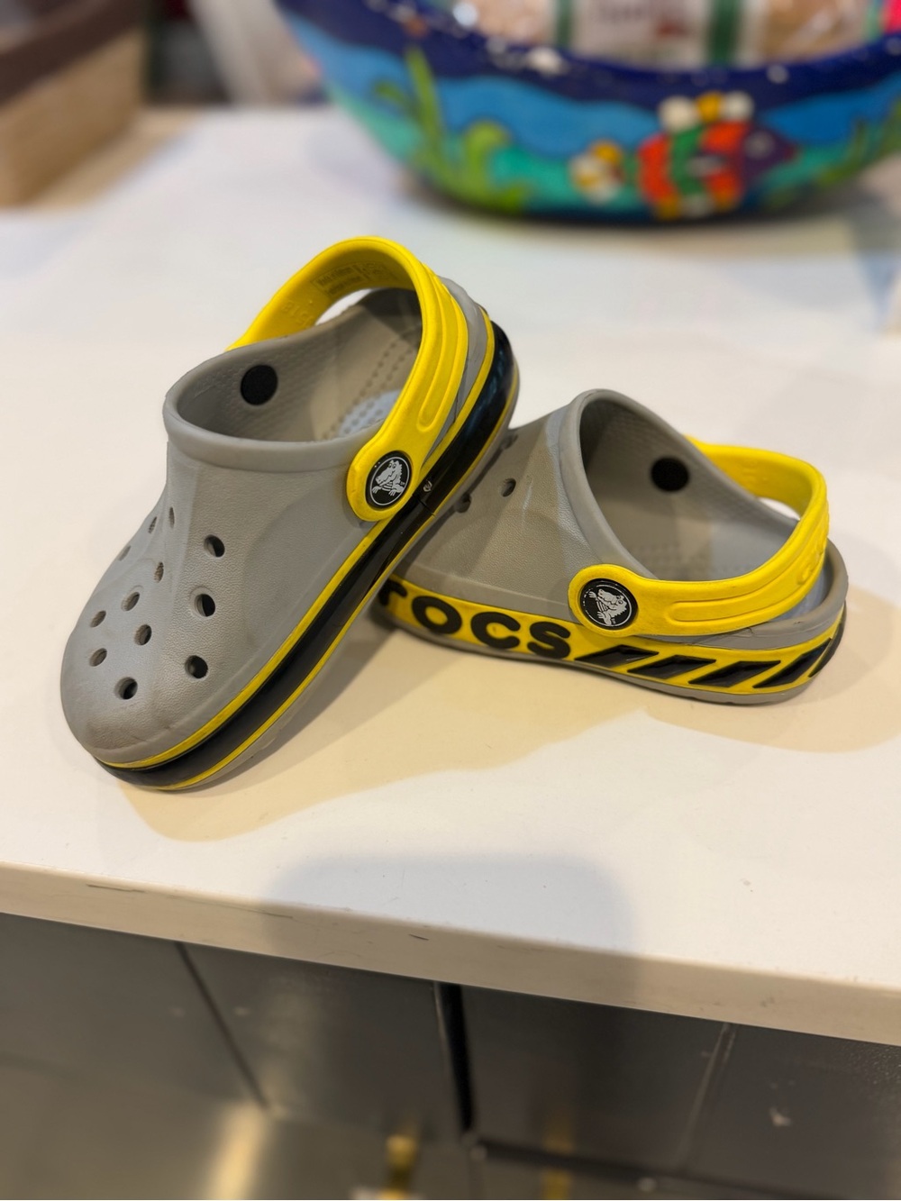 CROCS Kids Gray Clogs with Yellow Heel Strap